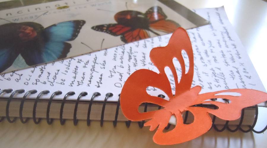 creative writing journal with paper butterfly
